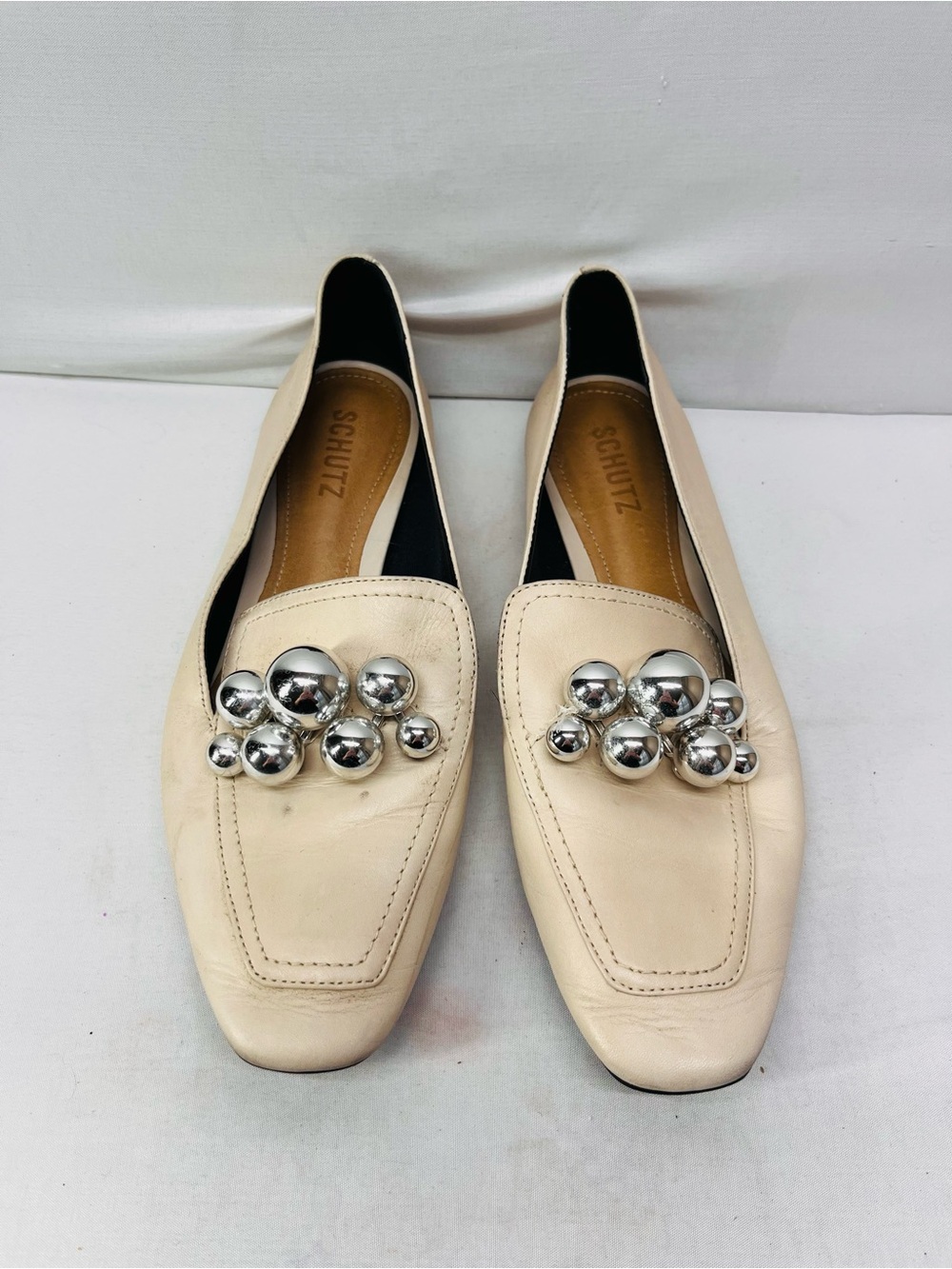 SCHUTZ Cream Leather Loafers with Silver Orb Embellishments